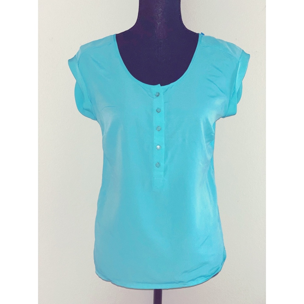 The limited. Turquoise blue blouse. Size small.